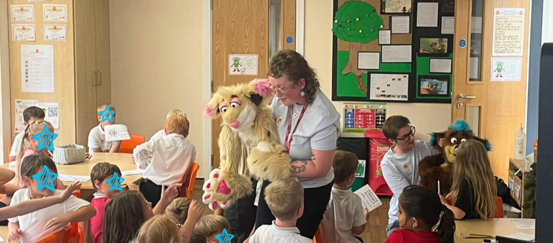 Two puppet characters meet the class of 5 year olds